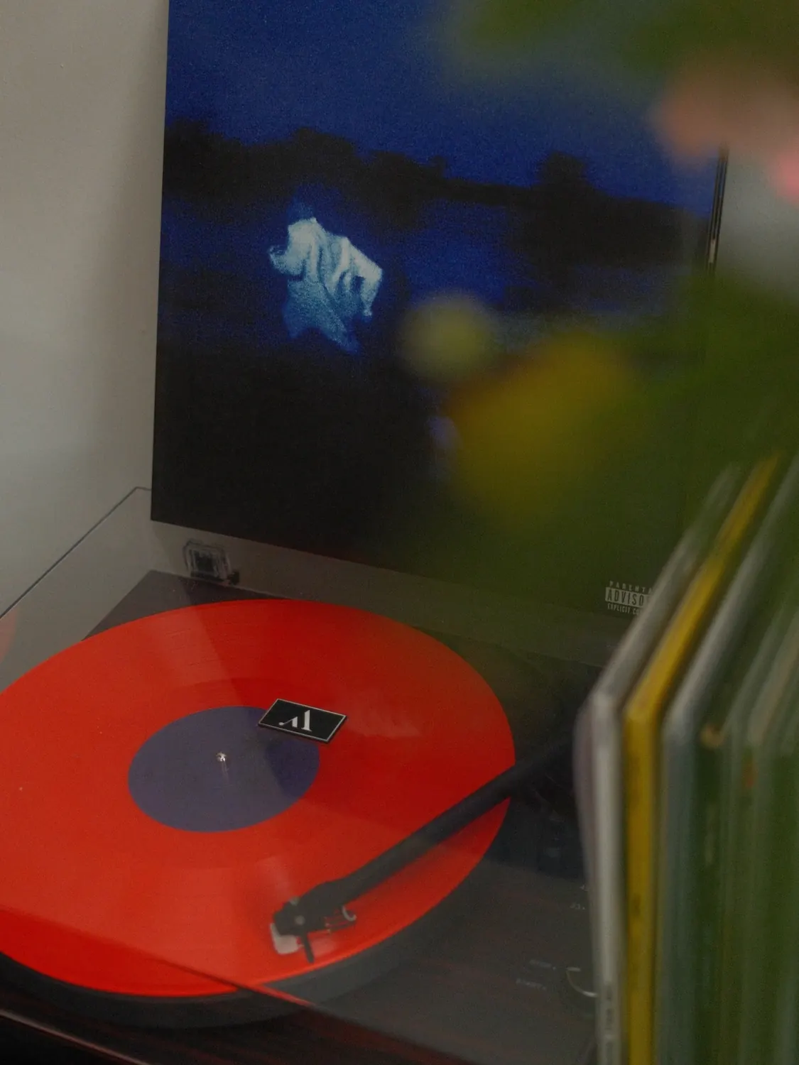 Red-toned still life inside a record shop