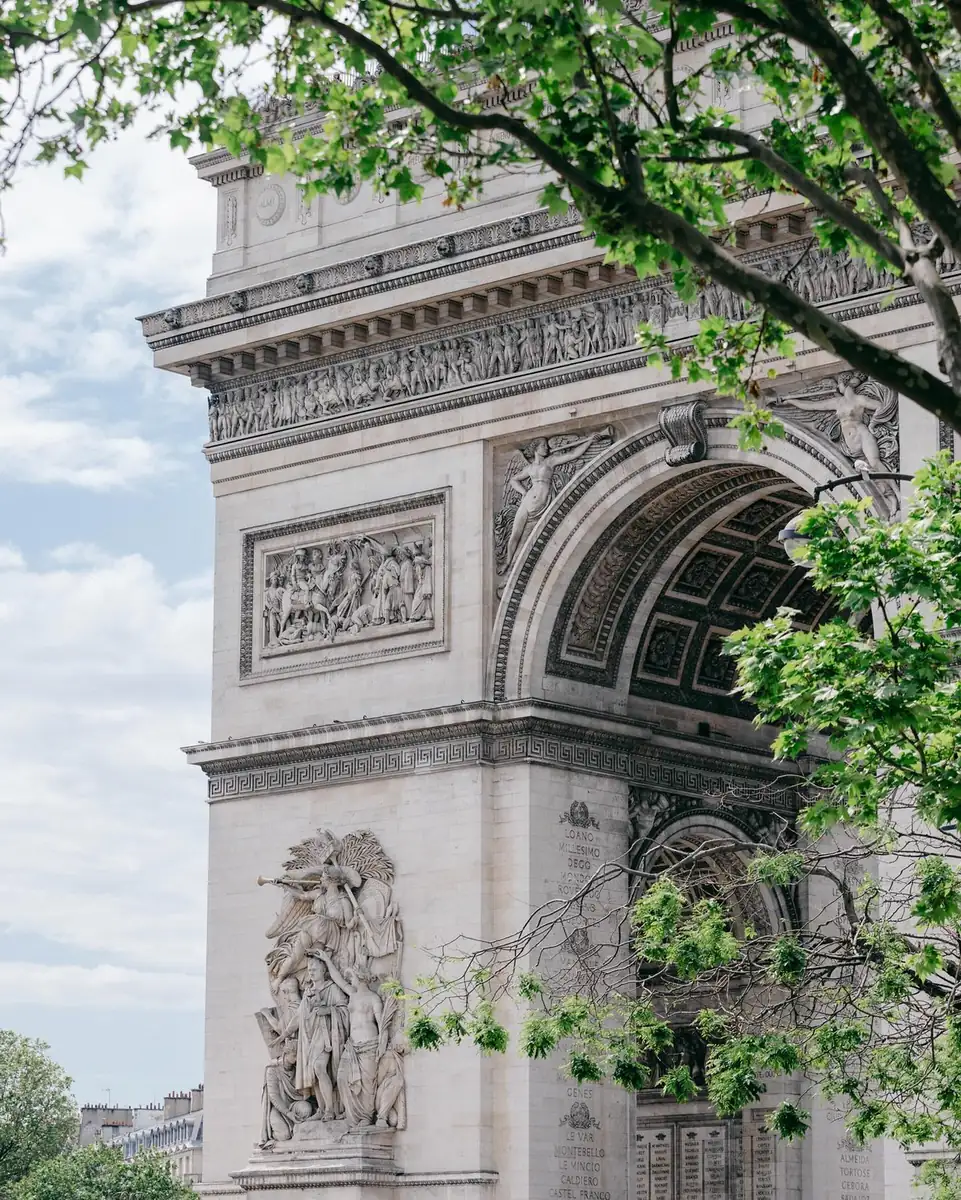 Arc de Triomphe seen through green leaves